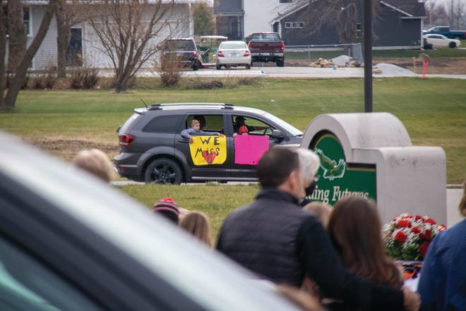 Signs decorate vehicles during a drive-thru visitation on Saturday, Nov. 21 for Charlie Brewer in Woodward.
