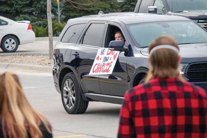Signs decorate vehicles during a drive-thru visitation on Saturday, Nov. 21 for Charlie Brewer in Woodward.